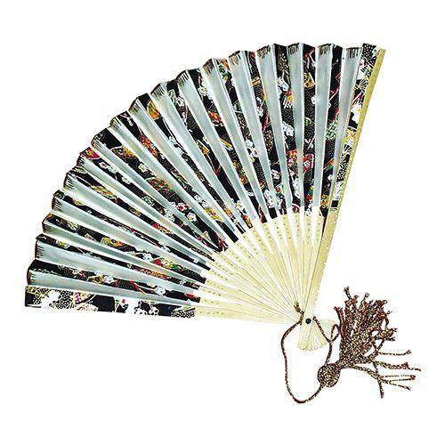 Paper fan painted in black and white with a tassel