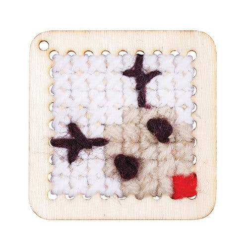 Cross-stitch house picture sewn on a punched card