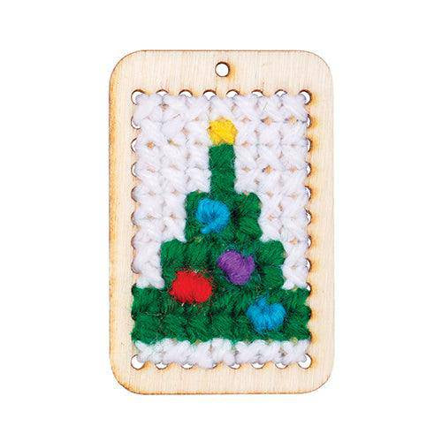 Cross-stitch Christmas tree sewn on a punched card